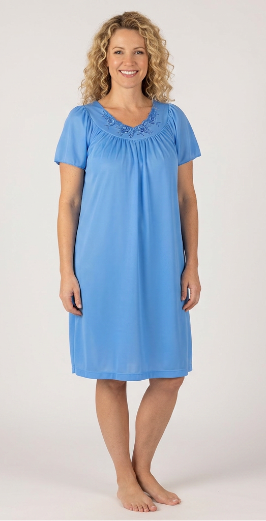 Woman wearing a blue nightgown against a plain background