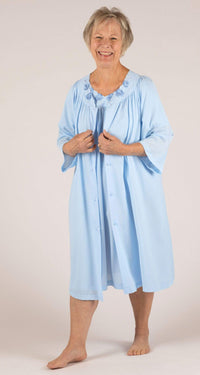 Woman wearing a Shadowline Petals Collection ¾ Sleeve Button Down Short Robe in the color Bluebell