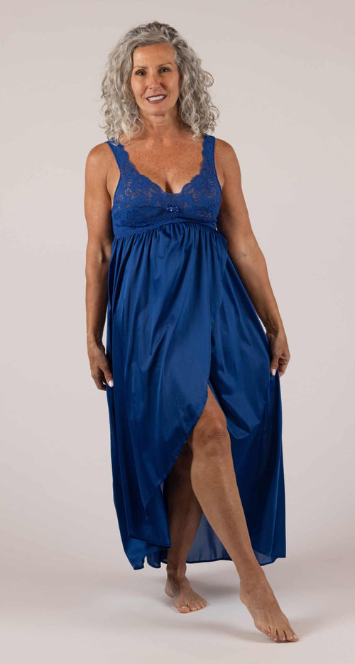 A woman wearing a Shadowline Silhouette Collection Tulip Hem lace Nightgown in the color Navy
